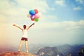 Young asian woman with colored balloons Royalty Free Stock Photo