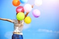 Young asian woman with colored balloons Royalty Free Stock Photo