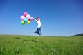 Young asian woman with colored balloons Royalty Free Stock Photo