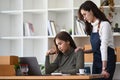 Young woman comforting her friend having problems in business. Royalty Free Stock Photo