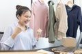 Young Asian woman congratulated and smiled as a large number of customers ordered her clothes online, Business of selling clothes