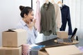 Young Asian woman congratulated and smiled as a large number of customers ordered her clothes online, Business of selling clothes