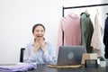 Young Asian woman congratulated and smiled as a large number of customers ordered her clothes online, Business of selling clothes