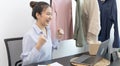 Young Asian woman congratulated and smiled as a large number of customers ordered her clothes online, Business of selling clothes