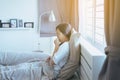 Young asian woman coughing and sitting on her bed,Concept of health Royalty Free Stock Photo