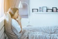 Young asian woman coughing and sitting on her bed,Concept of health Royalty Free Stock Photo