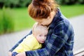 Young asian woman with cute caucasian toddler boy