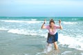 Young Asian woman in a cute dress at the beach