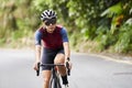 young asian woman cycling on rural road Royalty Free Stock Photo