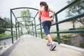 Young asian woman doing excercise outdoor in a park, jogging Royalty Free Stock Photo
