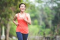 Young asian woman doing excercise outdoor in a park, jogging Royalty Free Stock Photo