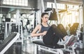 Young asian woman doing situp or crunches in gym,Female exercise muscular her stomach Royalty Free Stock Photo