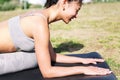 young asian woman doing yoga exercises in the park Royalty Free Stock Photo