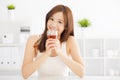 Young asian woman drinking hot tea Royalty Free Stock Photo