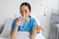 young asian woman drinking water while Royalty Free Stock Photo