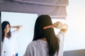 Young asian woman drying hair with towel,Female drying her long hair with comb Royalty Free Stock Photo