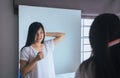 Young asian woman drying hair with towel,Female drying her long hair with comb Royalty Free Stock Photo