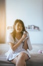 Young asian woman drying hair with towel,Female drying her long hair with dryer Royalty Free Stock Photo