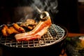 Young Asian woman eating BBQ in restaurant. Korean barbecue or Yakiniku in Japanese style. Close up Royalty Free Stock Photo