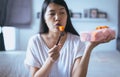 Young asian woman eating fresh fruits papaya slices,Concept healthy food Royalty Free Stock Photo