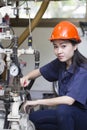 Young asian woman engineer set up and testing machine