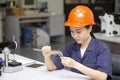 Close up young asian woman engineer using vernier height gauge, engineering in laboratory concept