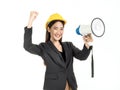 Young Asian woman engineer wearing black suit and yellow safety helmet holding a megaphone and raise her hand with success smiling