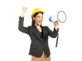 Young Asian woman engineer wearing black suit and yellow safety helmet holding a megaphone and raise her hand with success smiling