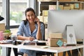 Young Asian woman entrepreneur/ Business owner working with computer at home Royalty Free Stock Photo