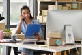 Young Asian woman entrepreneur/ Business owner working with computer at home Royalty Free Stock Photo