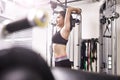 Young asian woman exercising working out in gym