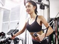 Young asian woman exercising working out in gym Royalty Free Stock Photo