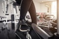 Young asian woman exercising on the xtrainer machines