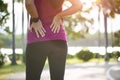 Young asian woman feel pain on her back and hip while exercising, health care concept Royalty Free Stock Photo