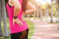 Young asian woman feel pain on her back and hip while exercising, healthcare concept Royalty Free Stock Photo