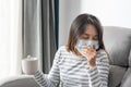 Young Asian woman feeling sick with cold and fever at home, Ill girl Royalty Free Stock Photo