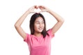 Young Asian woman gesturing heart hand sign.. Royalty Free Stock Photo