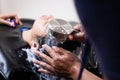 Young asian woman getting a hair wash by hairdresser at hair salon. Hairdresser washing hair of a young woman. Royalty Free Stock Photo