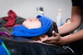 Young asian woman getting a hair wash and spa treatment by hairdresser at hair salon. Royalty Free Stock Photo