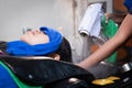 Young asian woman getting a hair wash and spa treatment by hairdresser at hair salon. Royalty Free Stock Photo