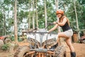 asian women is going to ride the atv with savety helmet on her head Royalty Free Stock Photo