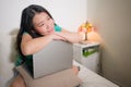 Young Asian woman with hand phone - lifestyle home portrait of happy and beautiful Korean girl on bed posing playful with mobile Royalty Free Stock Photo