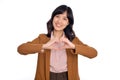 Young asian woman hands making a heart shape on a white isolated background Royalty Free Stock Photo