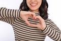 Young asian woman hands making a heart shape on a white isolated background Royalty Free Stock Photo