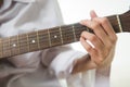 Asian woman hands touching guitar chords Royalty Free Stock Photo