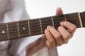 Young woman hands touching guitar chords Royalty Free Stock Photo