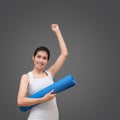 Young asian woman with happy smile holding her yoga mat Royalty Free Stock Photo