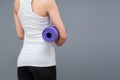 Young asian woman with happy smile holding her yoga mat Royalty Free Stock Photo