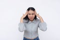 A young asian woman has an excruciating headache. Feeling a bad migraine. Isolated on a white background