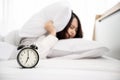 Young asian woman hates waking up early in the morning Royalty Free Stock Photo